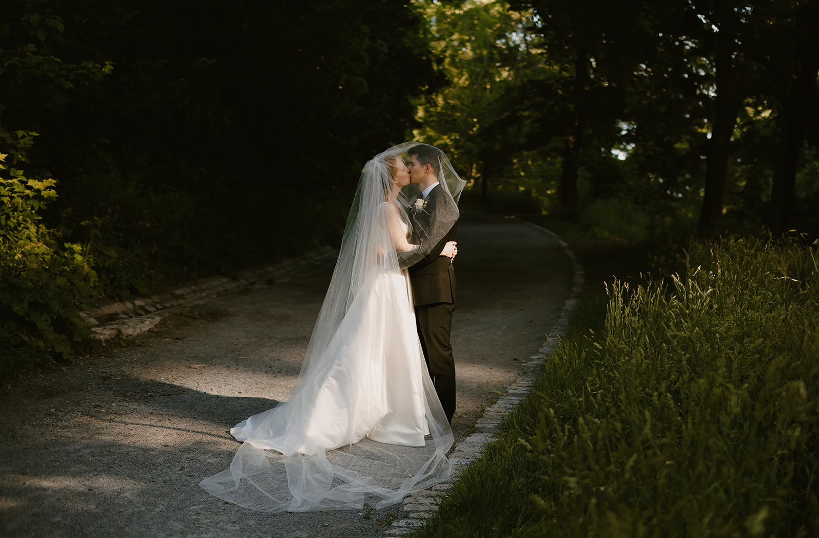 Bride and Groom under veil.