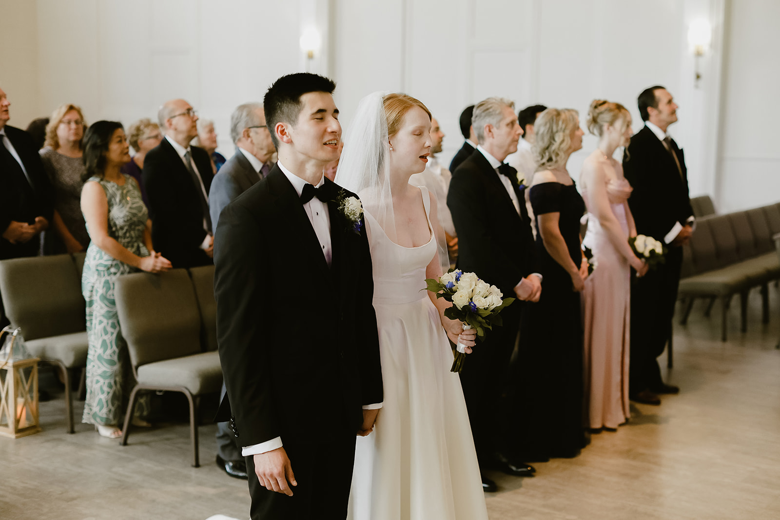 Bride and Groom sing at wedding. Wedding Photography