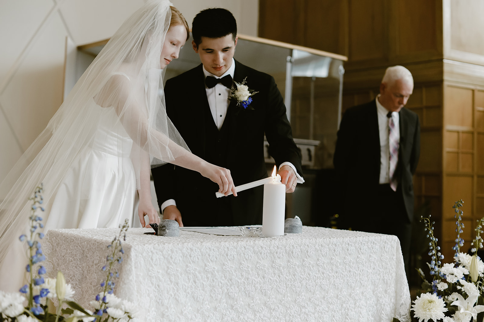 Bride and Groom Light candle. Wedding Photography