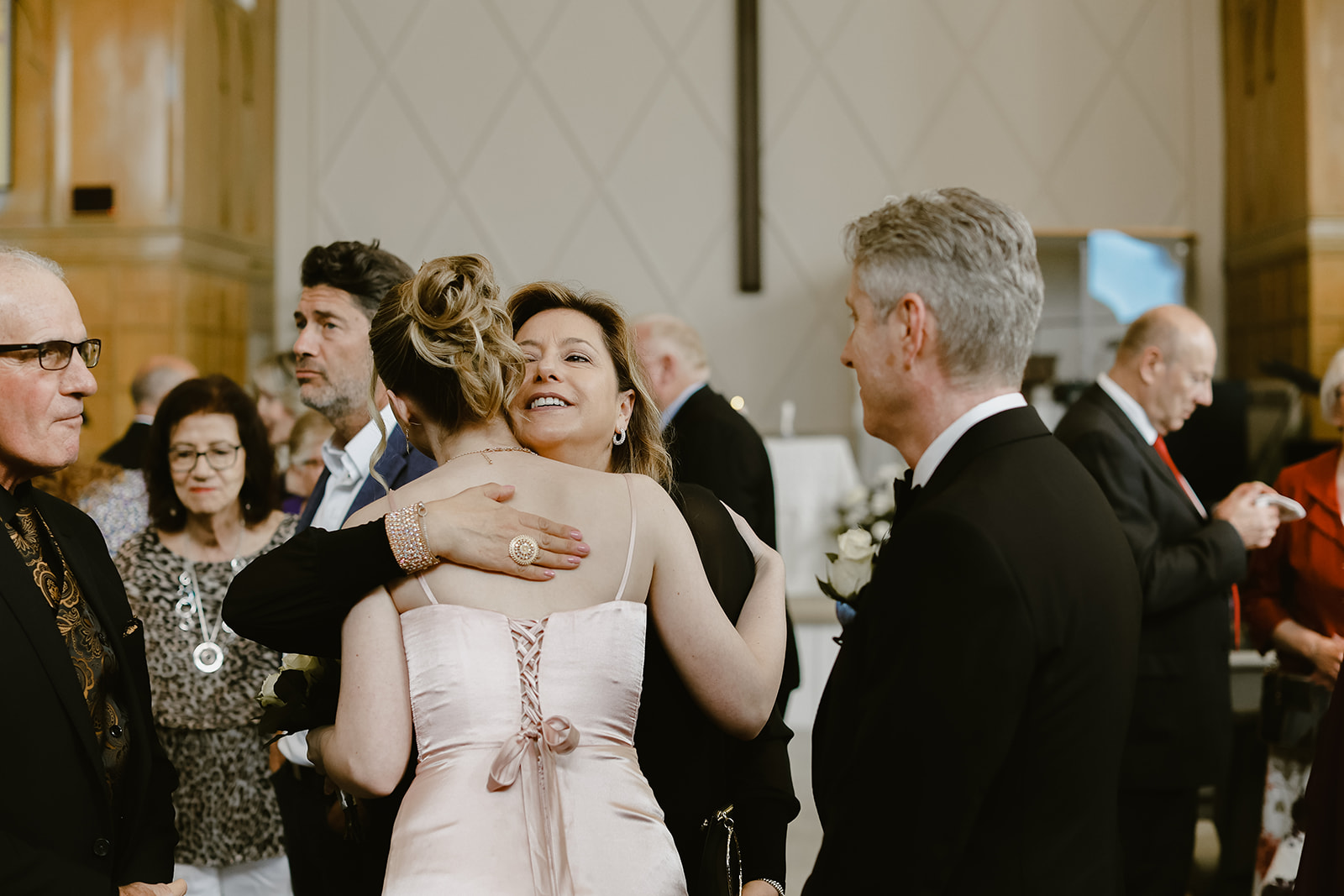 Guest hug at wedding