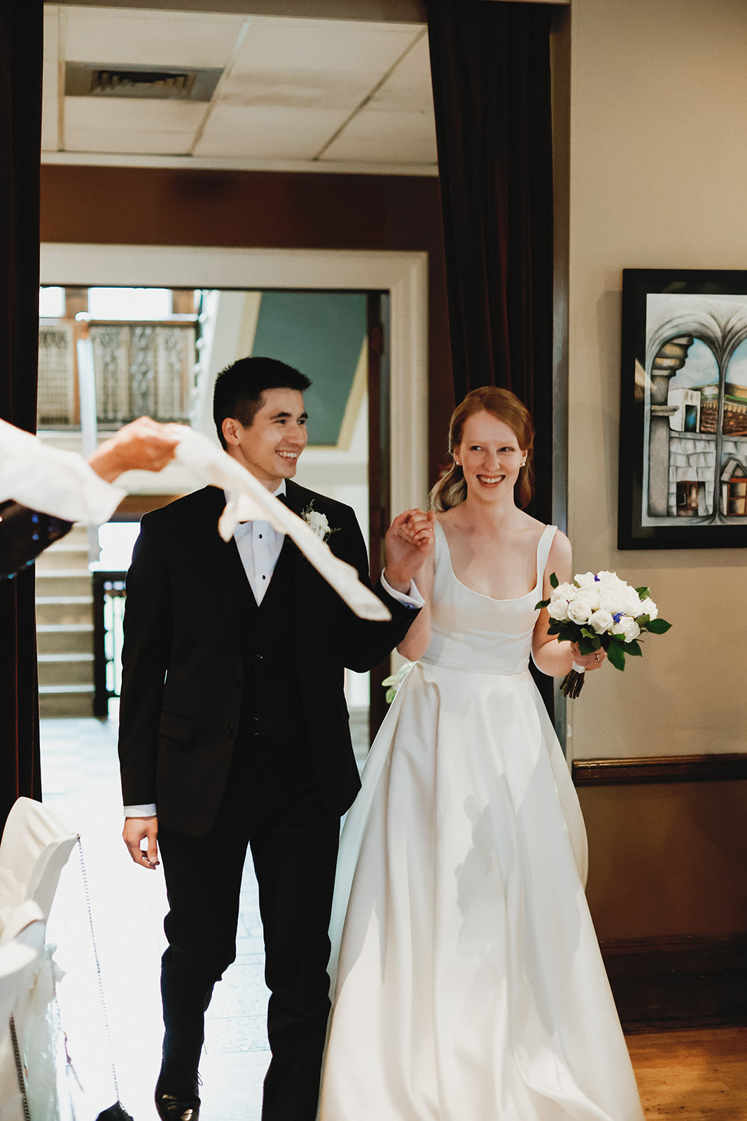 Bride and Groom walk into reception.