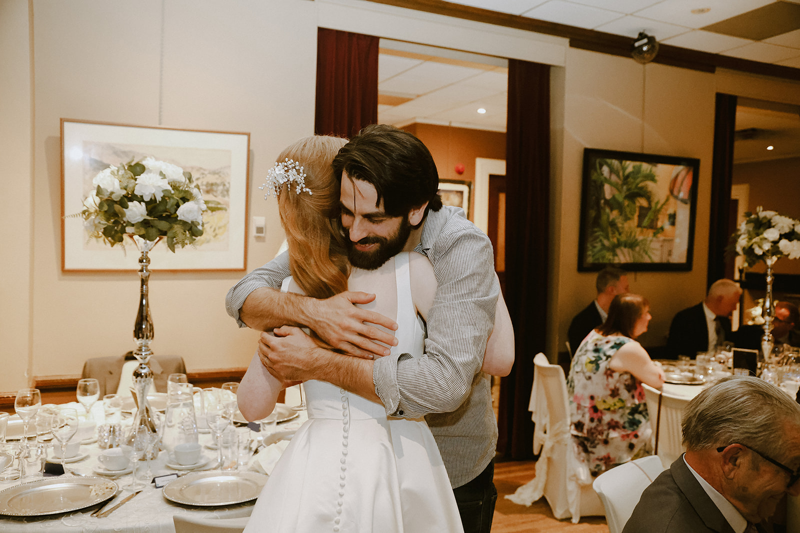 Guest hugs bride