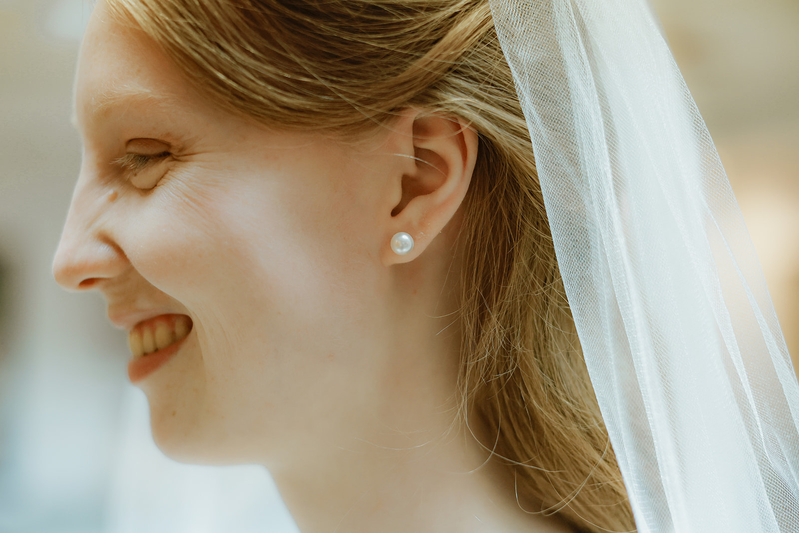 Close up side angle of bride.