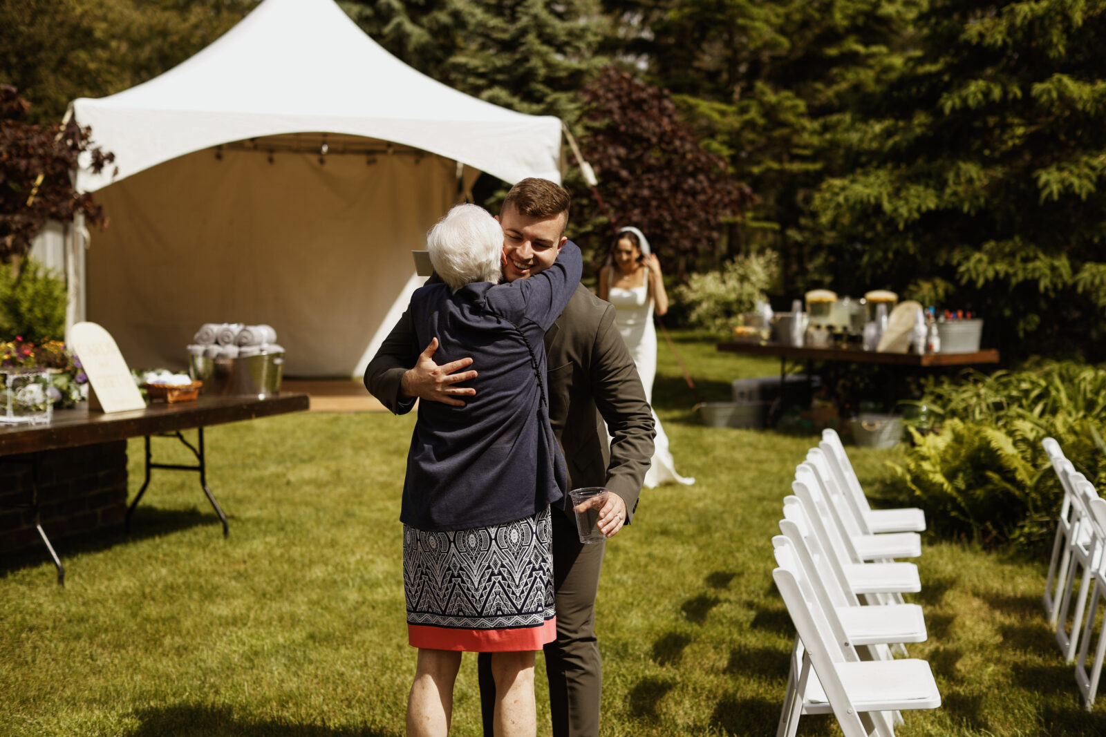 Guest hugs grrom - Wedding Photography - Kingston ON