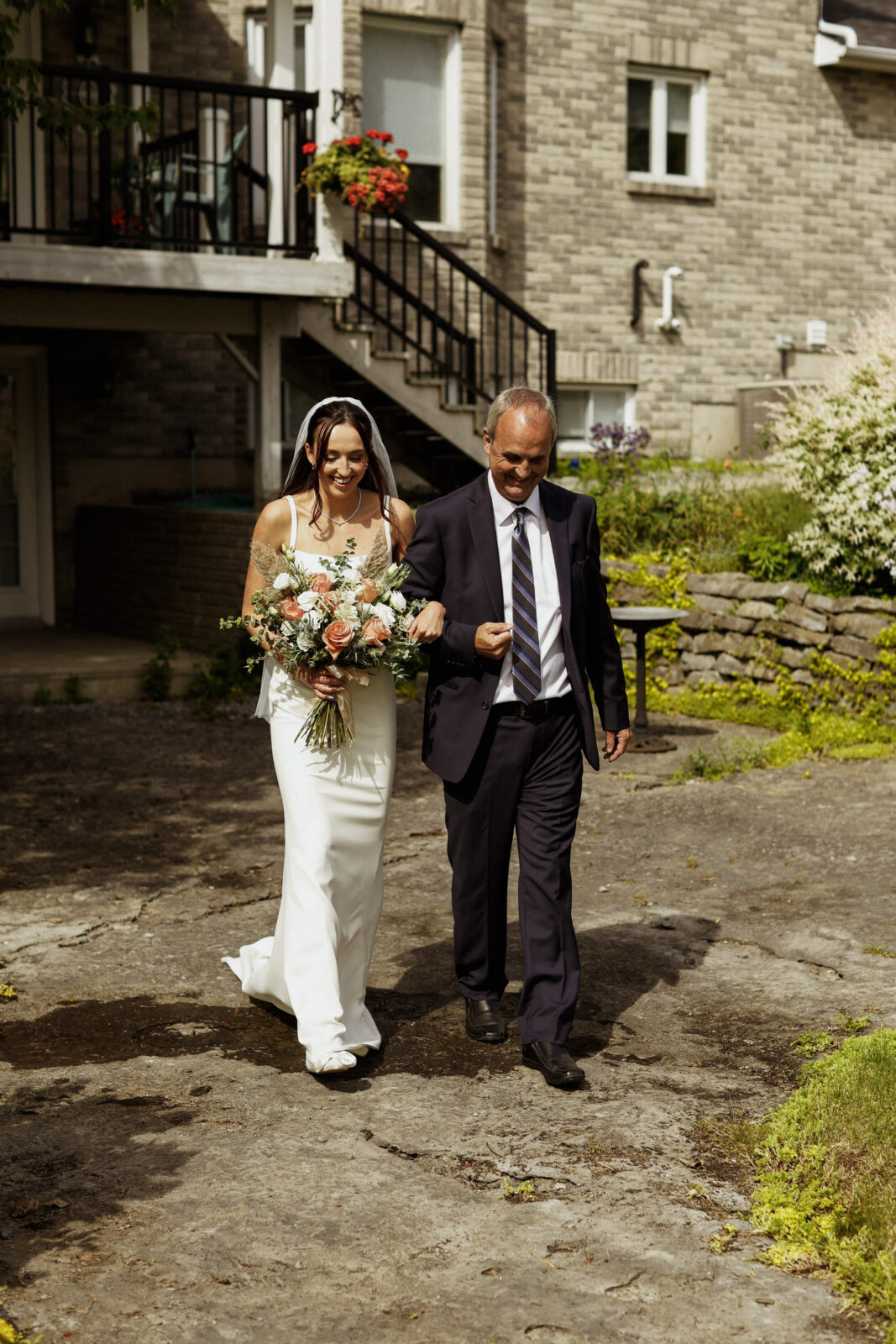 Bride walks down asile - Wedding Photography - Kingston ON