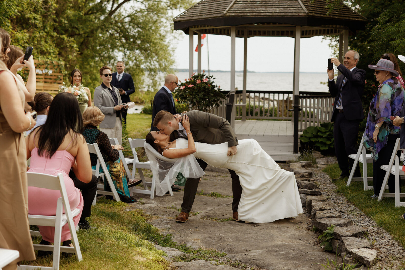 Bride and Groom Kiss at alter - Wedding Photography - Kingston ON