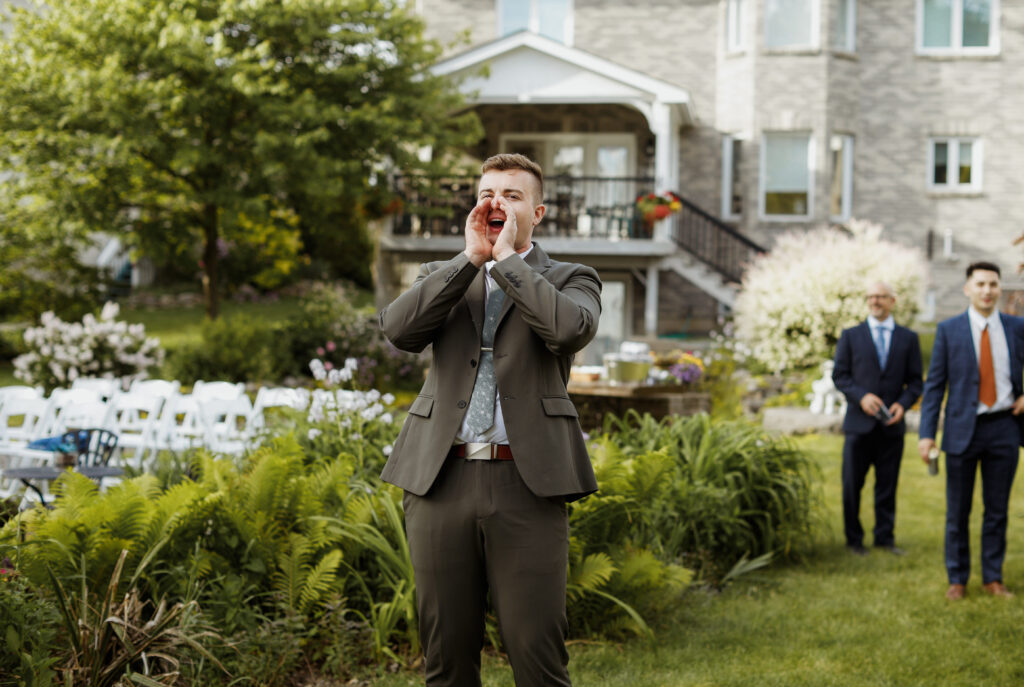 Groom calls everyone to dinner- Wedding Photography - Kingston ON