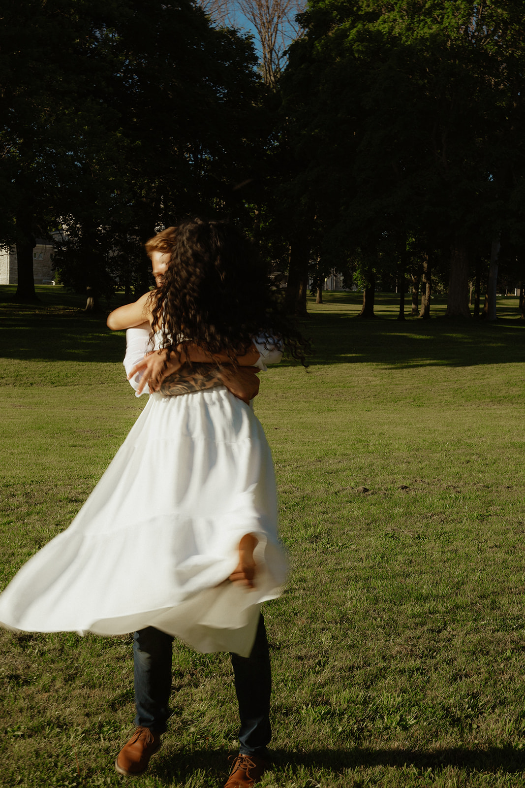 Man swings woman. Kingston Ontario photography 