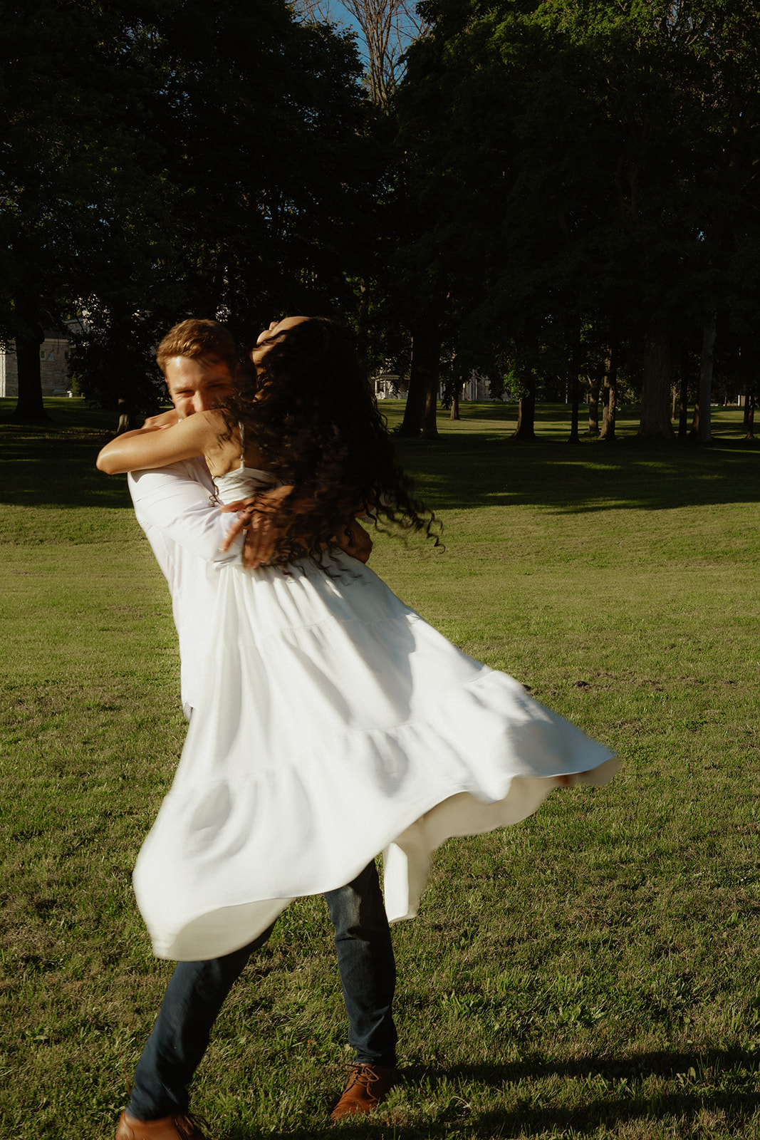 Man swings woman. Kingston Ontario photography 