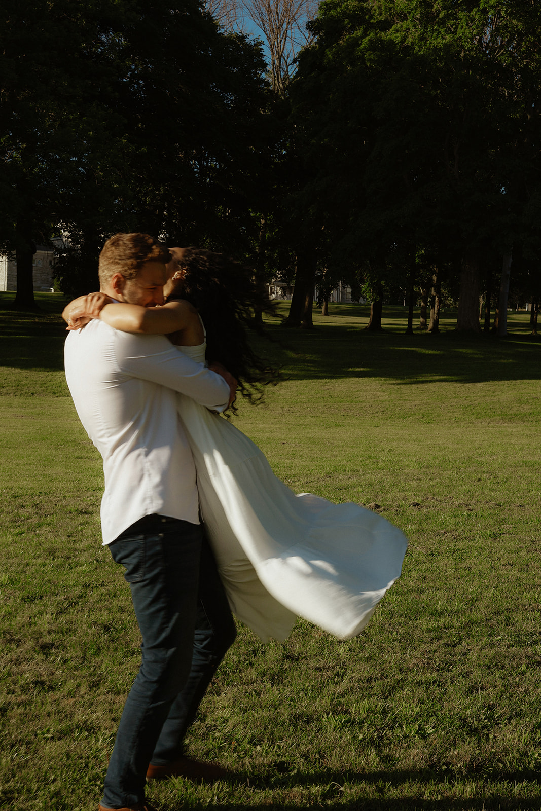 Man swings woman. Kingston Ontario photography 