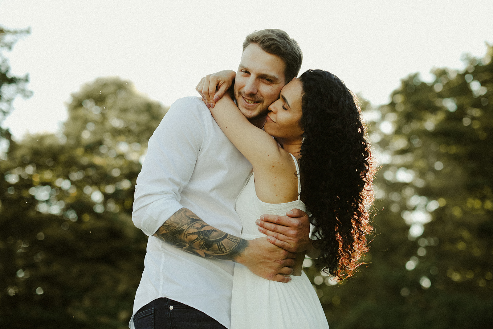 man and woman hug. Kingston Ontario photography 