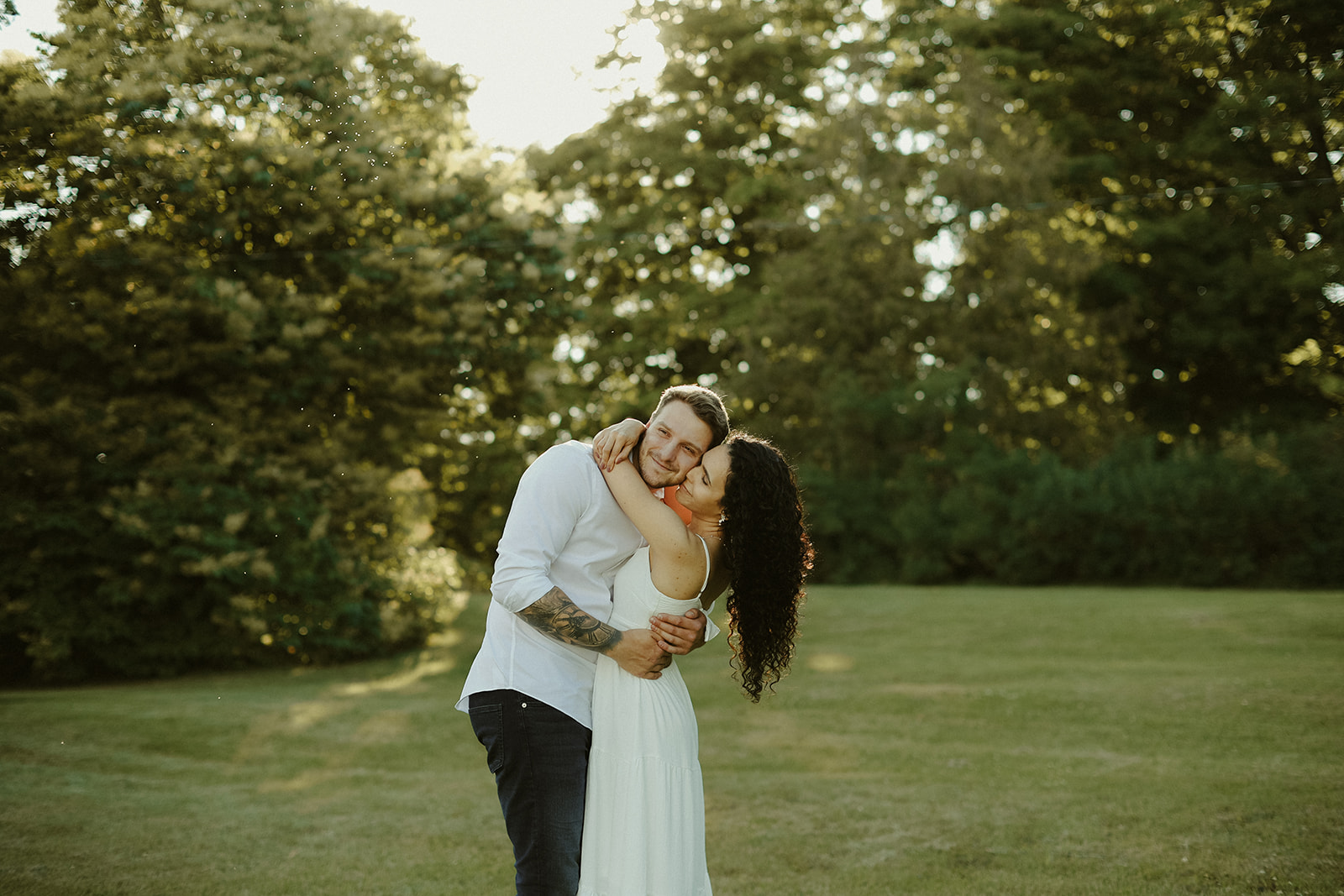 man and woman hug. Kingston Ontario photography 