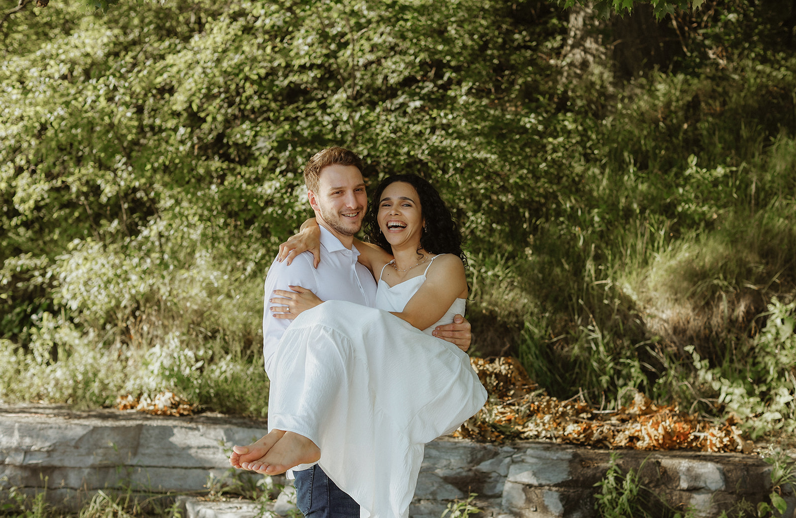 Man holds woman. Engagement Photo