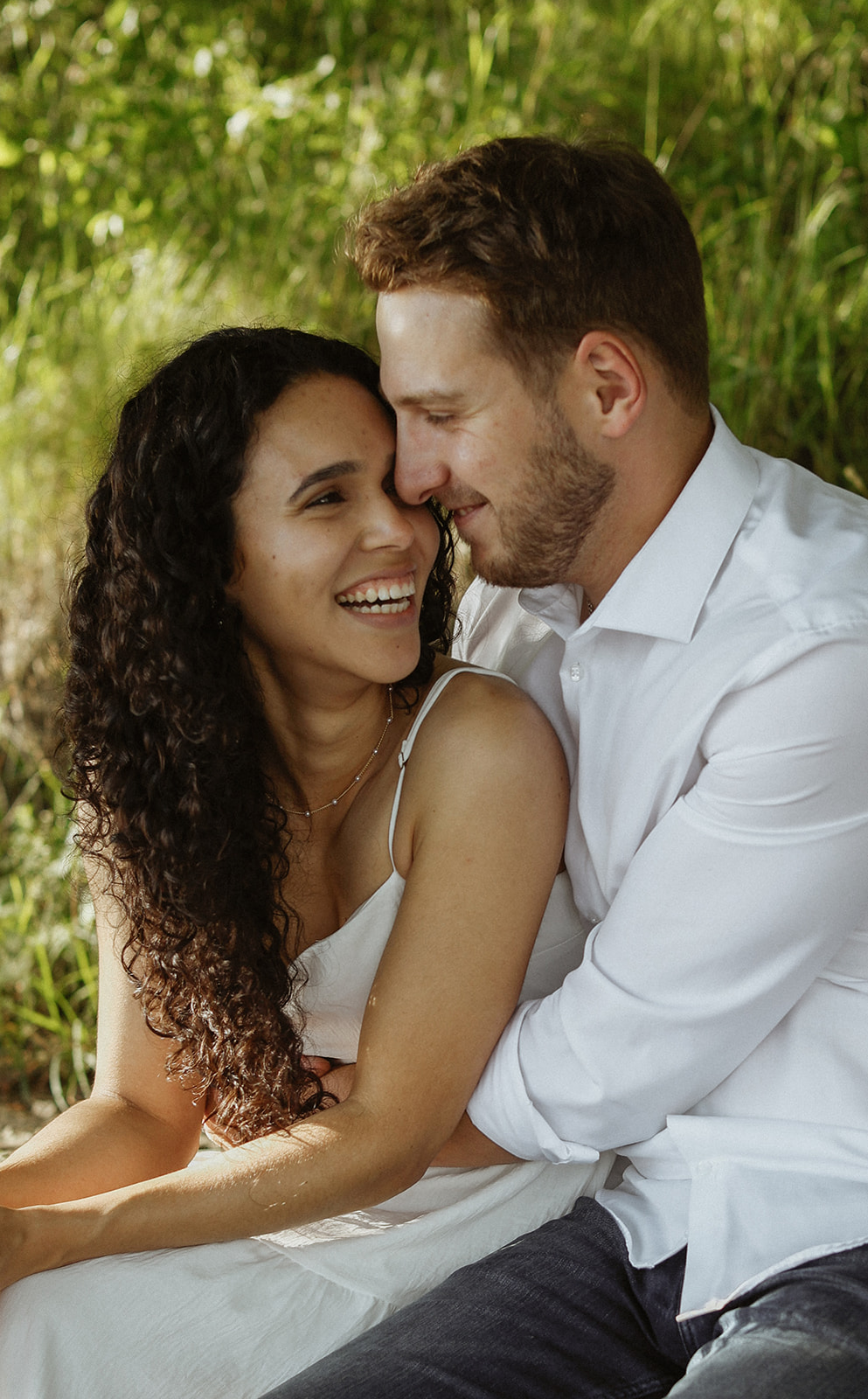 Man and woman cuddle. Engagement photography