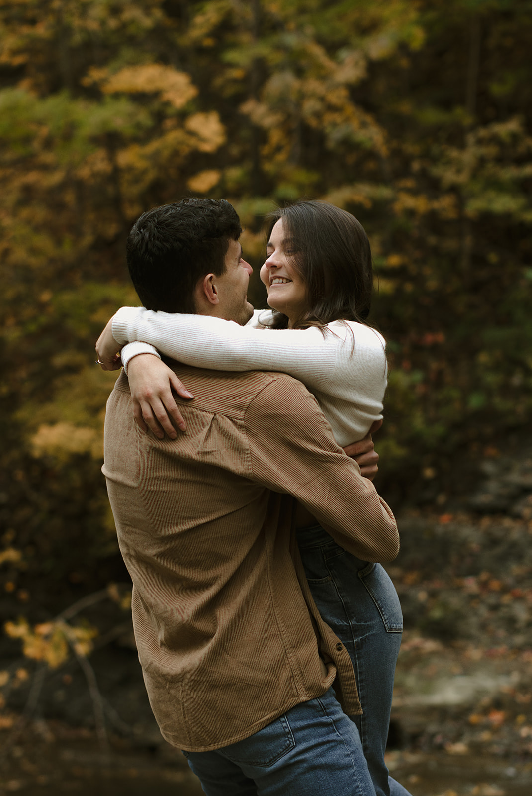 Couple hugging in scenic landscape - Engagement Photoshoot