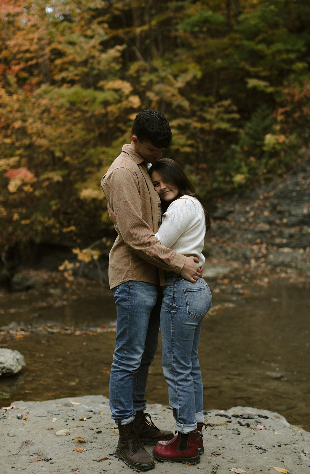 Couple hugging in scenic landscape - Engagement Photoshoot