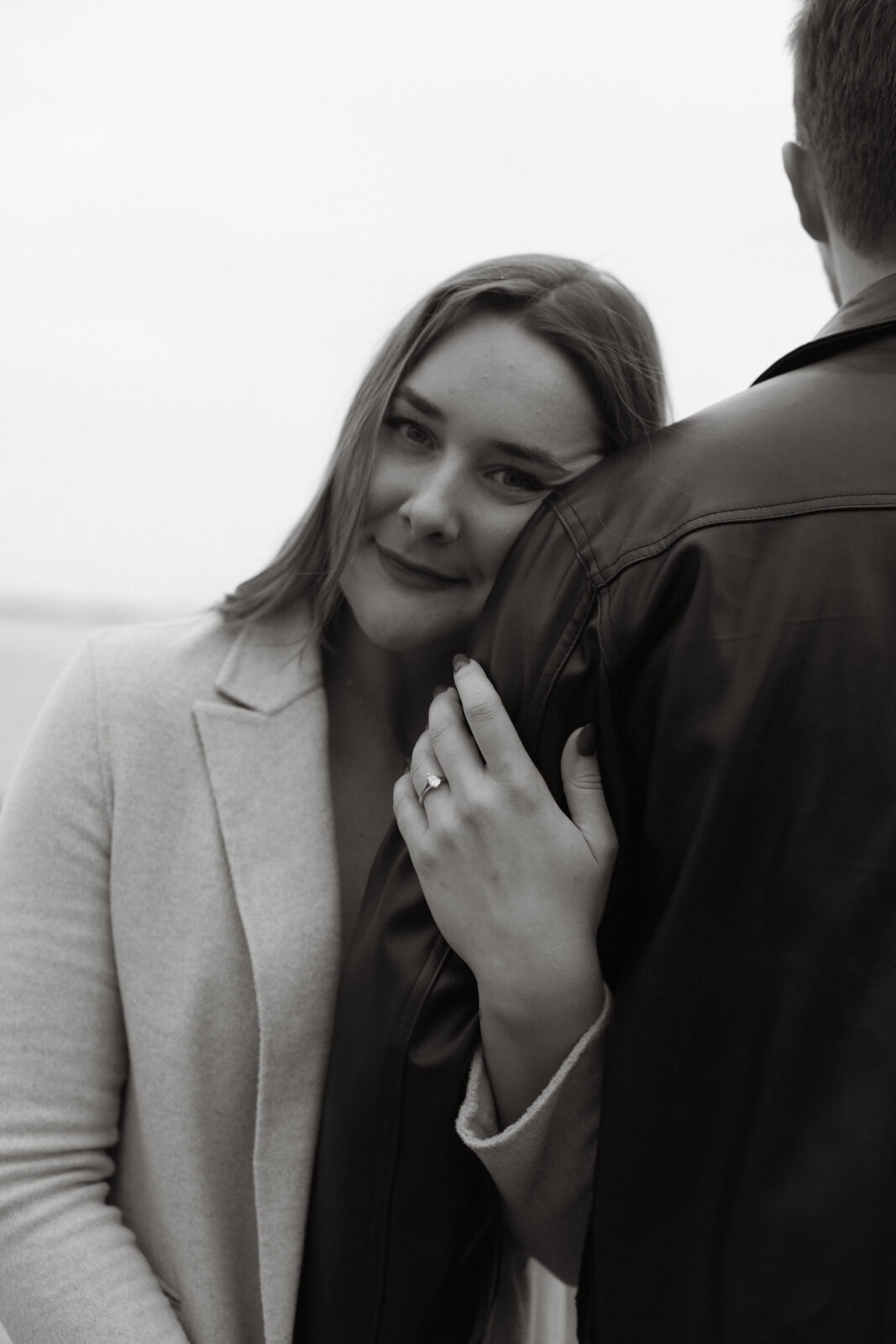 Couple next to lake Ontario- Kingston Ontario Engagement photo shoot 