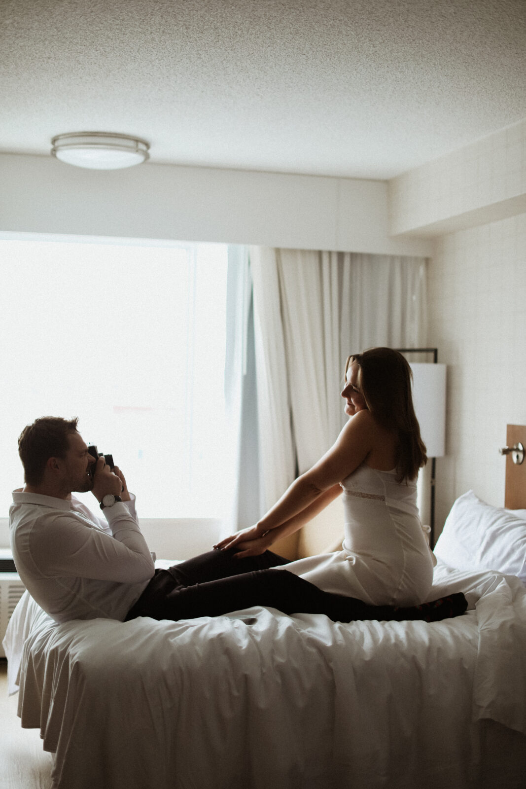 couple takes photo with polaroid camera