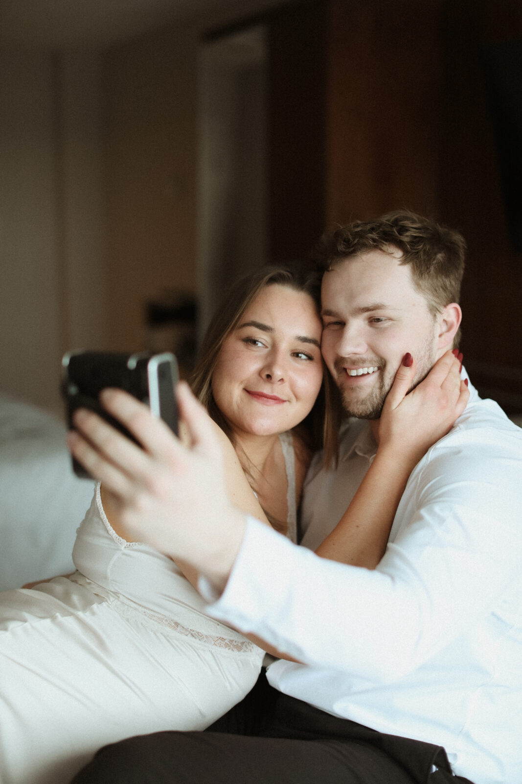 couple takes photo with polaroid camera