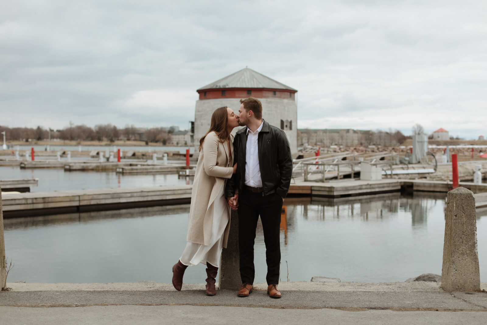 Couple next to lake Ontario- Kingston Ontario Engagement photo shoot 