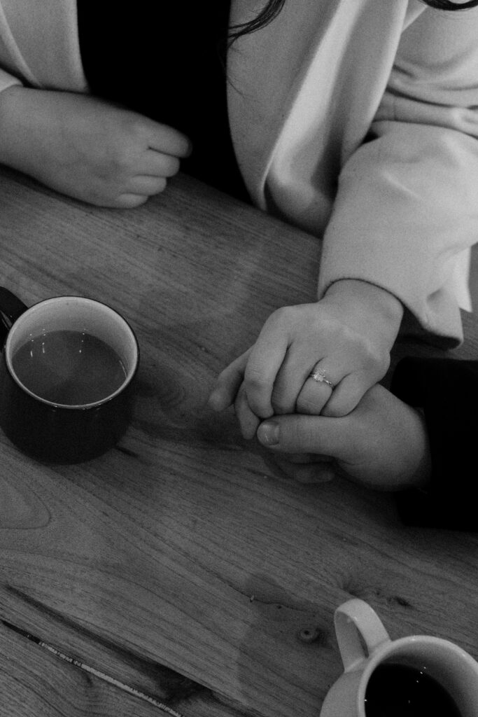 couple holds hands 
