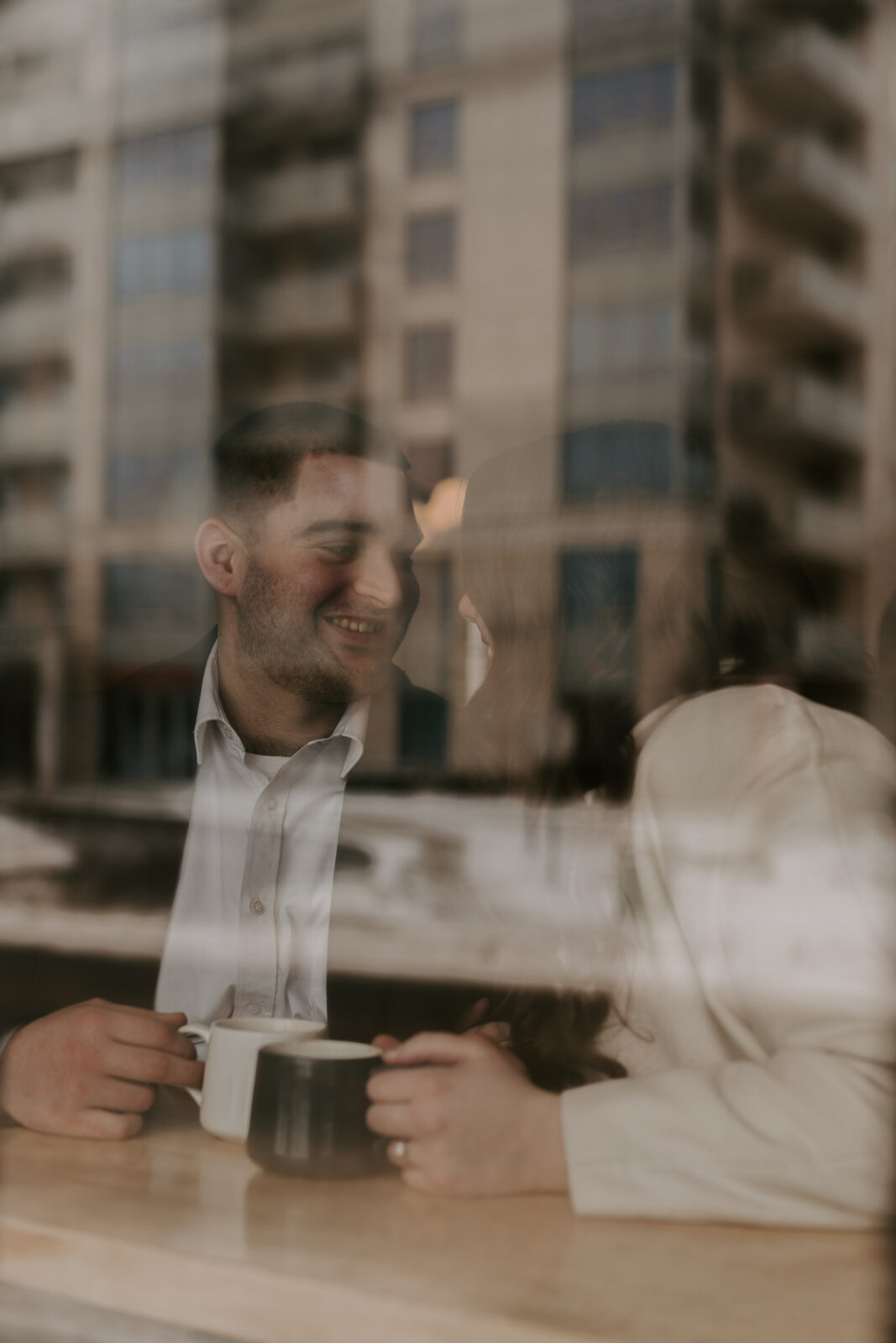 couple sits in coffee shop