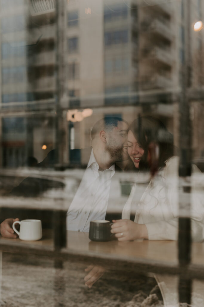 couple sits in coffee shop