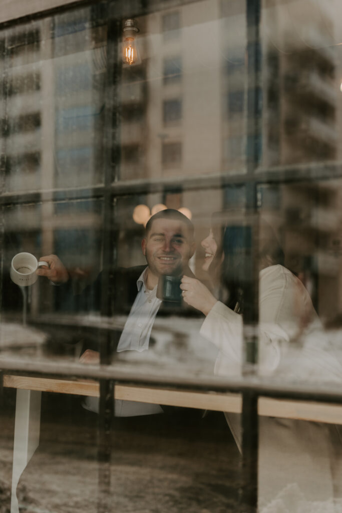 couple sits in coffee shop