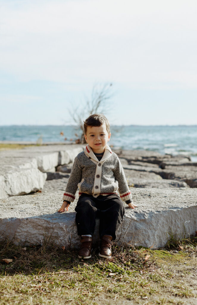 Kids sits on rocks, Kingston Ontario