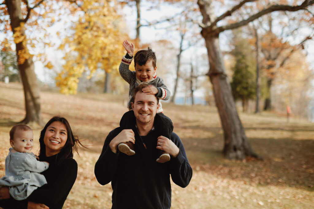 Family walks with Autumn colours in background