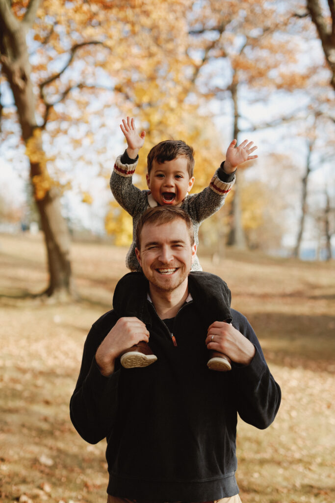 Dad has son his shoulders. Kingston Ontario Wedding Photography