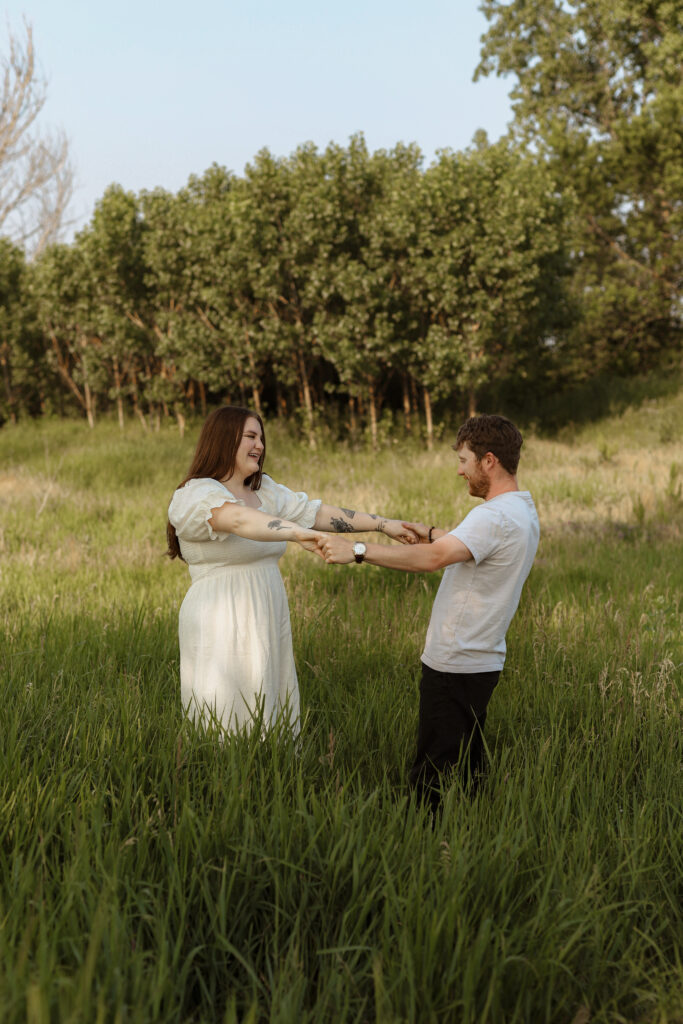Couple dances in field 