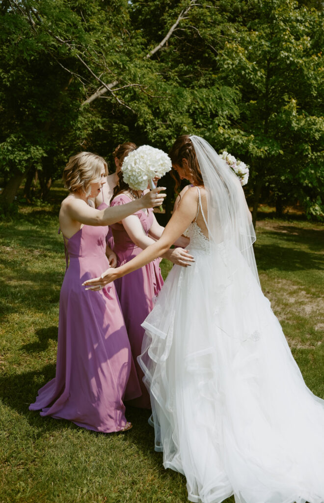 bride hugs bridesmaids