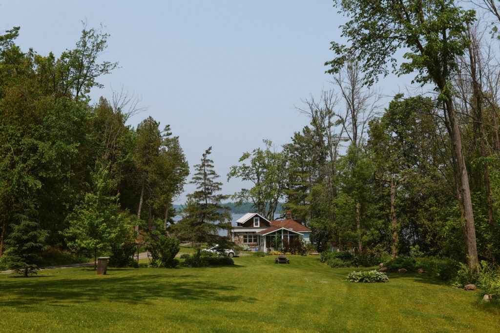 Far off house besides a lake