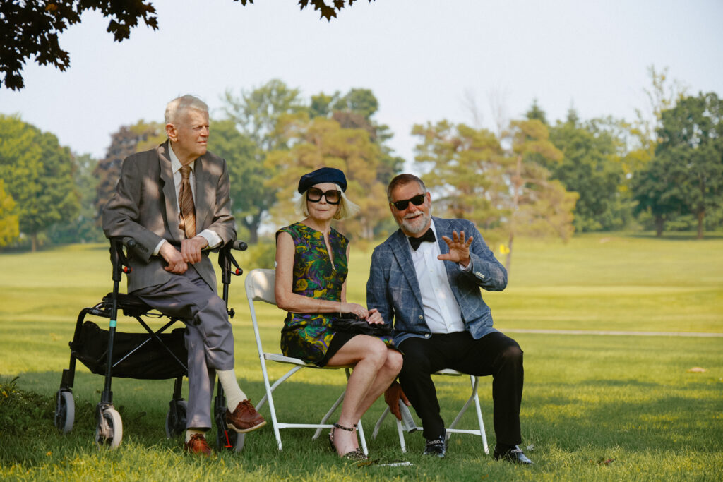 Guest at wedding sitting down at ceremony