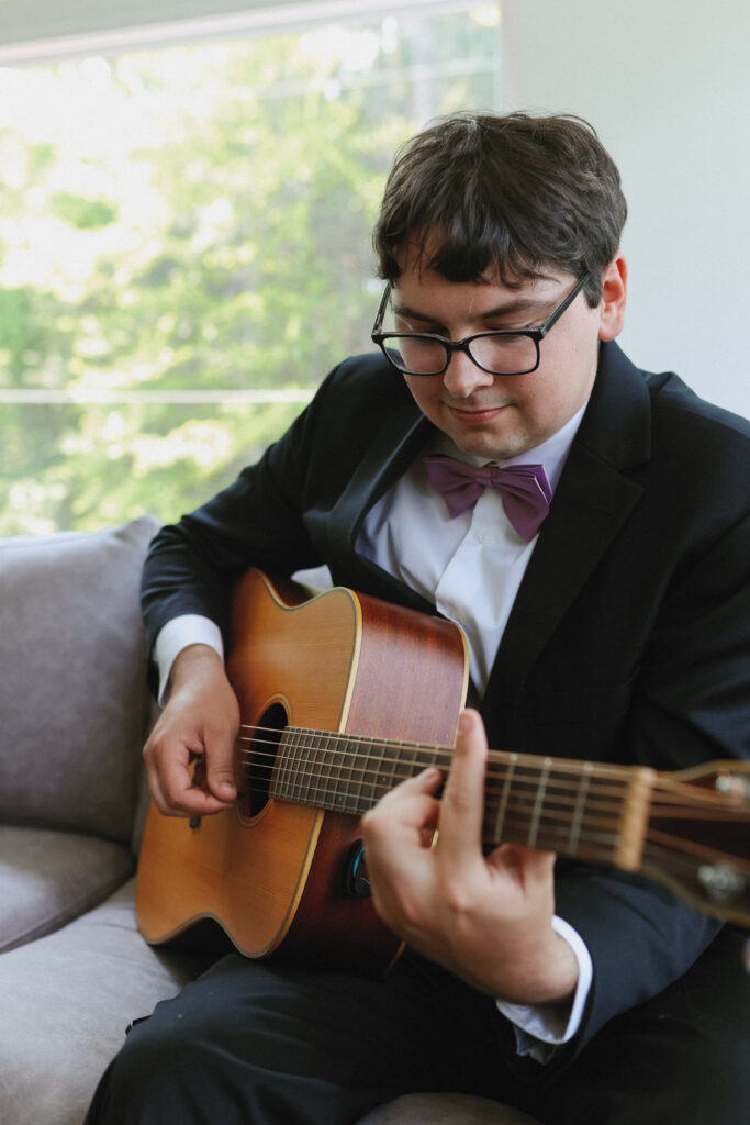 Groom plays guitar 