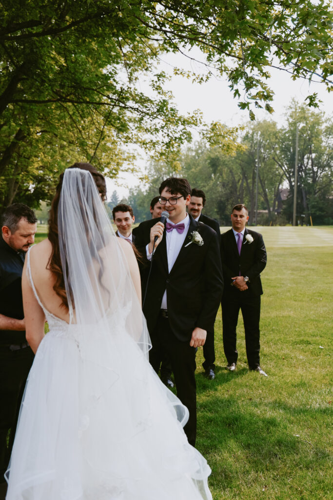 Groom speaks into microphone