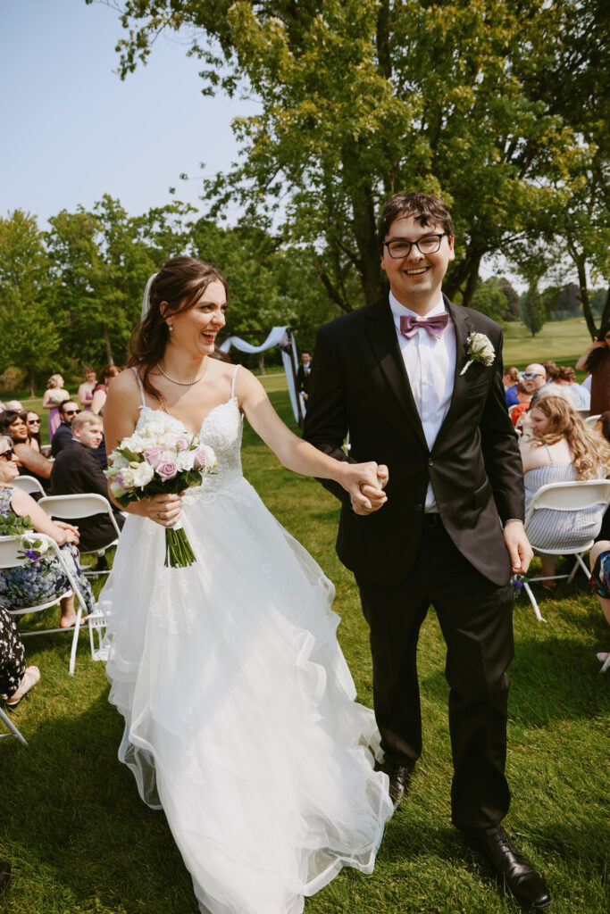  Bride and Groom walk down isle
