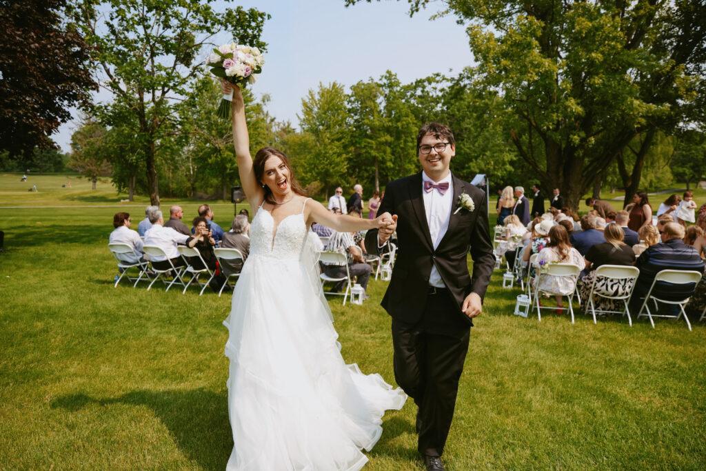  Bride and Groom walk down isle