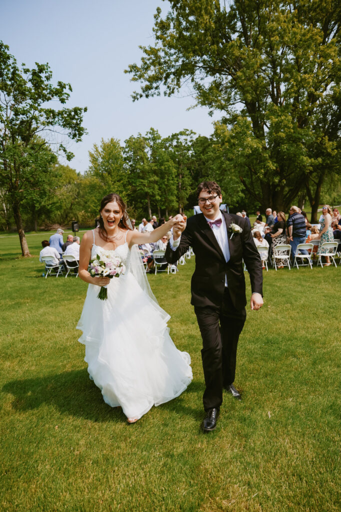  Bride and Groom walk down isle