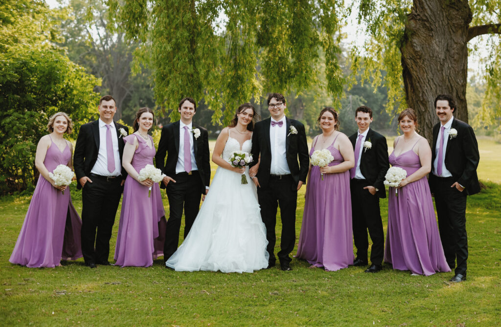 Bridal party smiling in a lineup