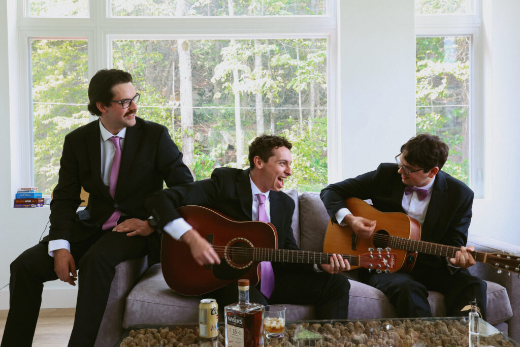 Groom and groomsmen play guitar together