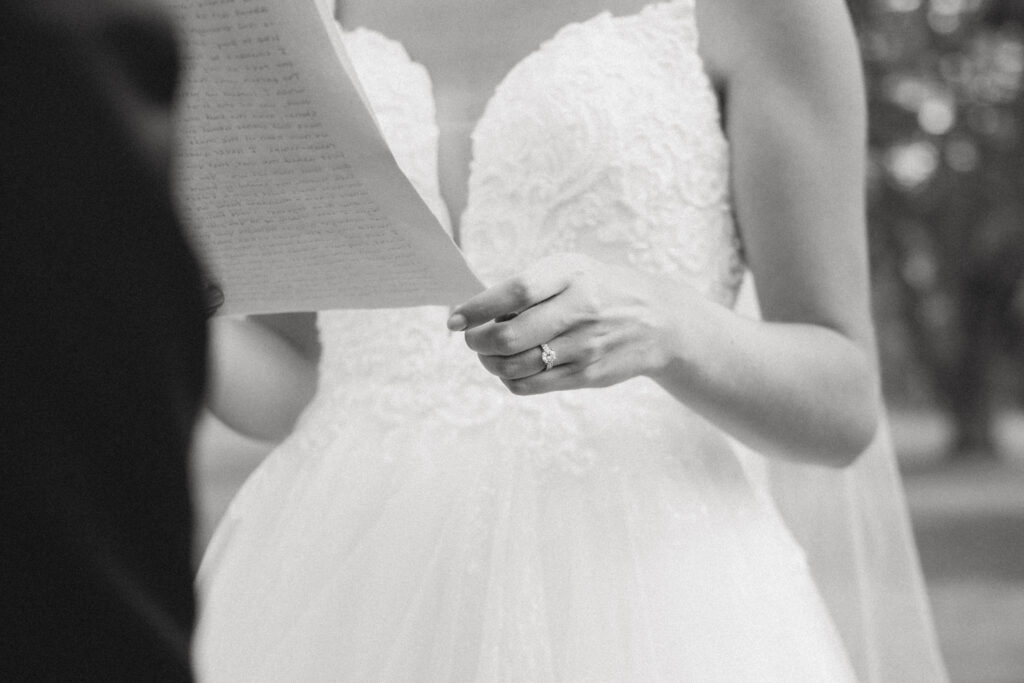 close up of bride holding vows
