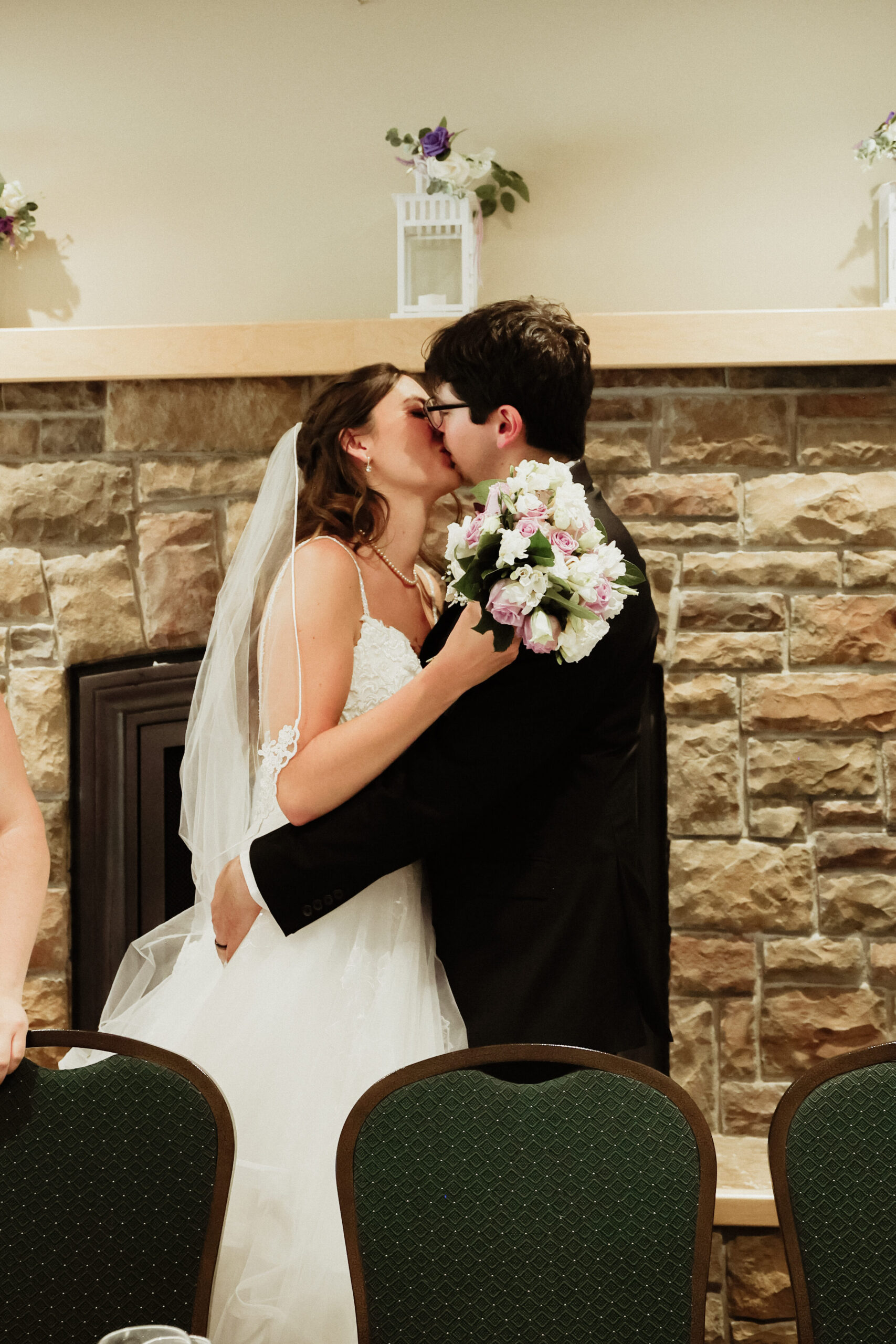 Bride and Groom kiss in front of guest