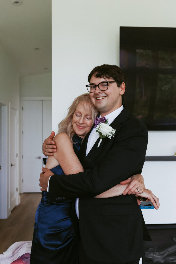 Groom hugs his mother