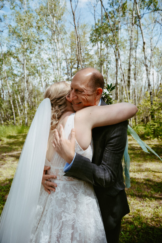 Bride hugs father