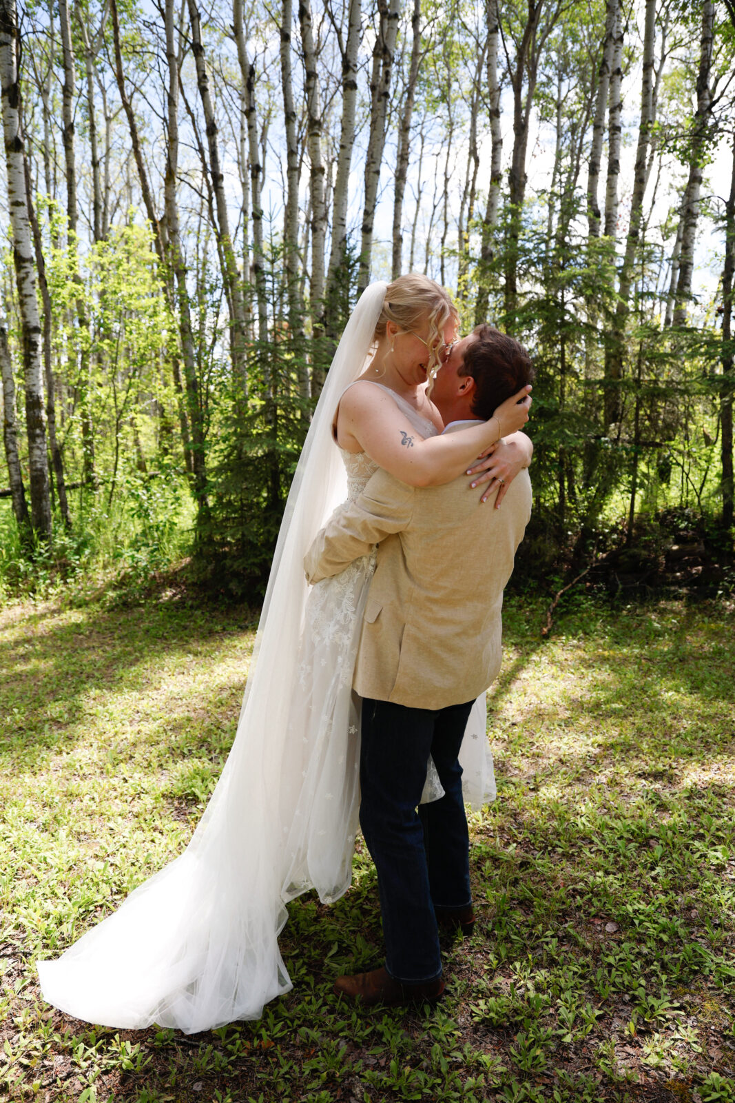 Groom picks up Bride