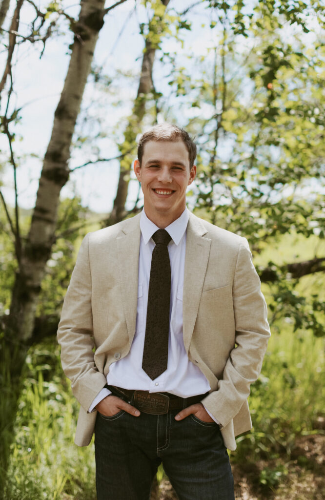 Image of groom with hands in pockets