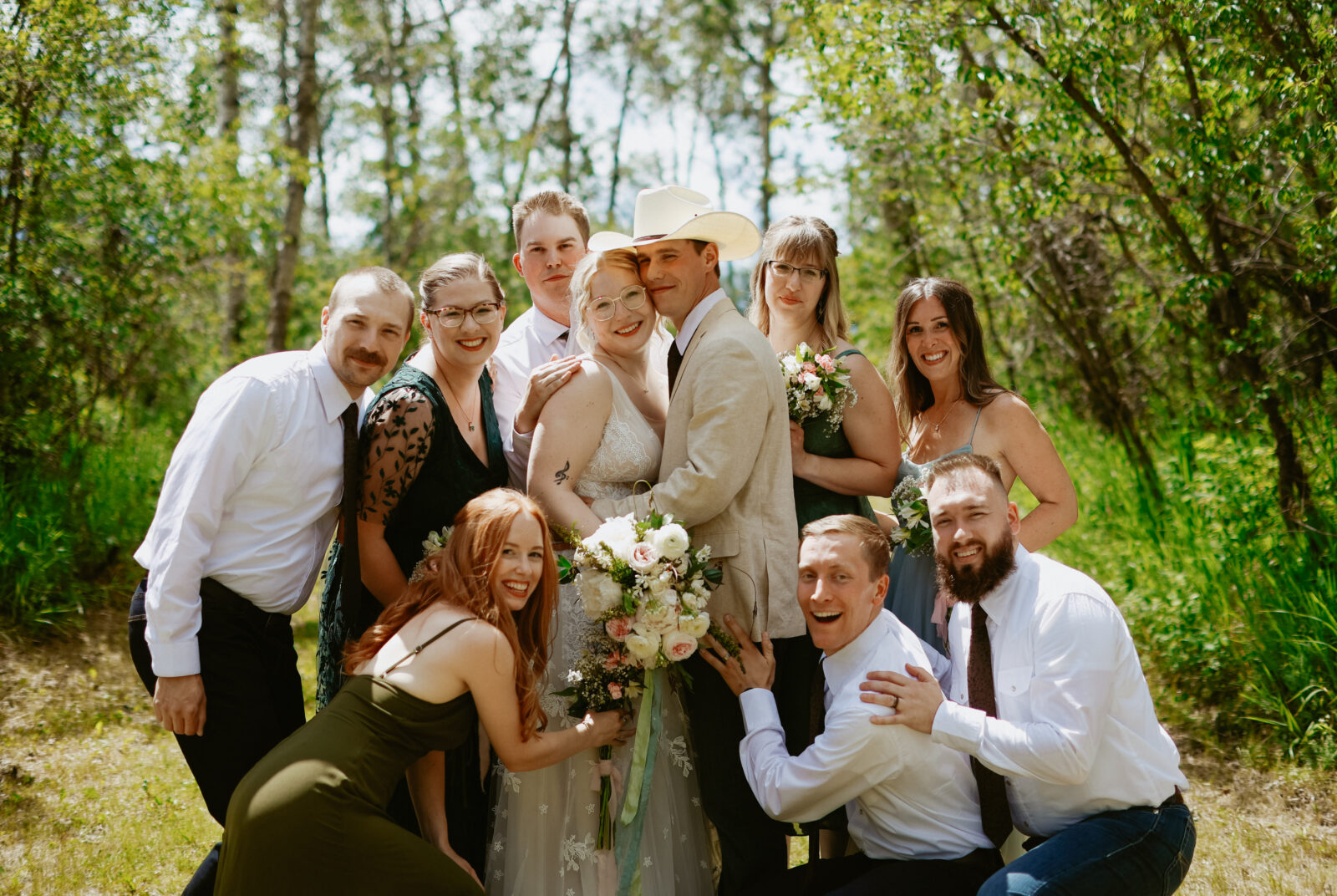 Bride and groom in the centre with bridal party around them. 