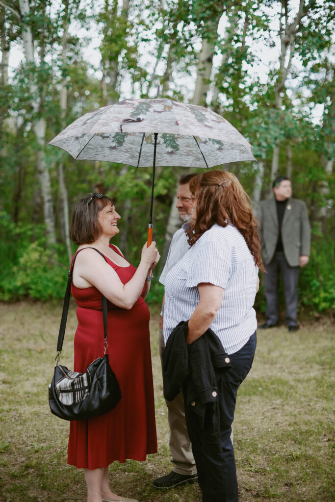 wedding guest under umbrella